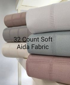 four sheets are stacked on top of each other with the words, 32 count soft aid fabric