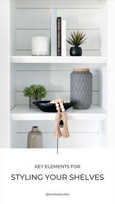 shelves with books, vases and other items on them in white painted shelving