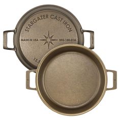 two pans sitting side by side on top of each other, one with a compass