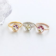 Pressed Flower Rings | Handmade Real Flower Rings | Christmas Gift | Bridesmaid Gifts | Birthday Gift for Mom | Resin Gift | Gift for Her ✨️The Pressed Flower Rings are beautiful and delicate pieces of jewelry that are handcrafted with love and attention to detail. Each ring features a real pressed flower that is carefully encased in a clear resin, preserving its natural beauty and vibrant colors. These rings make for stunning accessories, adding a touch of nature-inspired elegance to any outfit. -------------------------------------------------- ✨️ H I G H L I G H T S - Handmade with Love and Attention to Detail: Each pressed flower ring is meticulously crafted by skilled artisans, ensuring that every piece is unique and beautifully made. - Versatile and Stylish: The minimalist design of Flower Charm Jewelry For Wedding Gift, Wedding Gift Jewelry With Flower Charm, Silver Jewelry With Flower Decoration For Gift, Flower Shaped Ring For Wedding And Mother's Day, Nature-inspired Wedding Flower Ring With Birth Flower, Elegant Pressed Flowers Jewelry For Valentine's Day, White Dainty Flower Ring For Gift, Dainty White Flower Ring For Gift, White Dainty Flower Ring As Gift