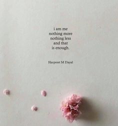 a pink flower sitting on top of a piece of paper next to a quote that says i am me nothing more including less thought is enough