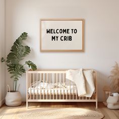 a baby crib in a white room next to a potted plant