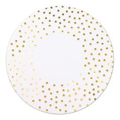 a white plate with gold dots on it