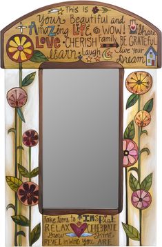 a decorative mirror with flowers painted on it