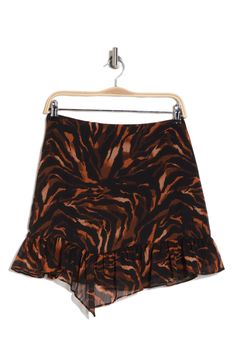 A flouncy asymmetric hem adds playful style to this flirty miniskirt covered in a tiger print. Back zip closure 100% polyester Machine wash, line dry Imported Tiger Print Outfits, Tiger Skirt, Tiger Print Skirt, Playful Style, Party Animal, A Tiger, Animal Birthday, Tiger Print, Good American