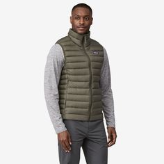 The perfect warmth for just about everything, The Patagonia Men's Down Sweater™ Vest in Pine Needle Green is lightweight and windproof with a shell built of NetPlus® 100% postconsumer recycled nylon ripstop made from recycled fishing nets to help reduce ocean plastic pollution, and it's insulated with 800-fill-power 100% Responsible Down Standard down certified by Control Union (CU 880272). The purchase of Responsible Down Standard certified products demonstrates demand for better animal welfare Ocean Plastic Pollution, Patagonia Down Sweater, 50% Logo, Cheer Girl, Fishing Nets, Man Down, Plastic Pollution, Vests Mens, Outerwear Vest