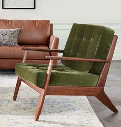 a green chair sitting in front of a brown couch