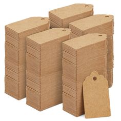 a pile of brown cardboard tags with a price tag on one side and a stack of smaller ones in the middle