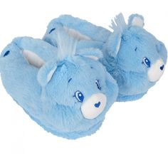 a pair of blue slippers with an animal face