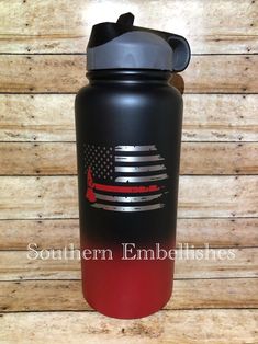 a black and red water bottle with an american flag on it