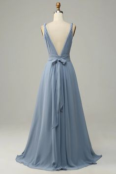 the back of a blue dress on a mannequin headdress with a bow at the waist