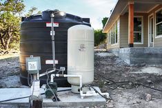 a water heater sitting in front of a house