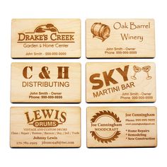 four wooden business cards with different logos on them