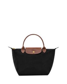 In a miniature size, Longchamp's signature nylon tote lends sophisticated style to every look. The lightweight design folds up for ease during travel. Top Handle Handbags, Nylon Tote, Folded Up, Longchamp Le Pliage, Black Handbags, Sophisticated Style, Small Tops, Top Handle, Handbags