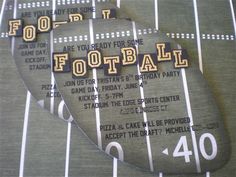 two pieces of wood that say football are on the side of a striped sheet of paper