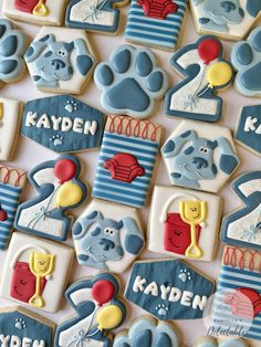 decorated cookies are displayed on a table