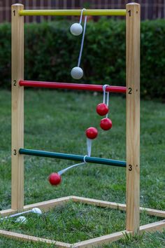 an outdoor game made out of wooden sticks and balls