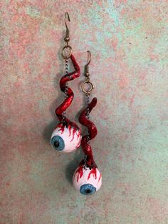 These eyeball dangles are the perfect statement piece. They scream: look at me and my bloody eyeball earings! Inspired by the movie A clockwork orange, put your own spin on the classic movie cosplay.  For customizations please message me dorectly with purchase Fun Red Halloween Jewelry, Red Fun Halloween Jewelry, Fun Red Jewelry For Halloween, Movie Cosplay, A Clockwork Orange, Weird Jewelry, Clockwork Orange, Funky Earrings, Funky Jewelry