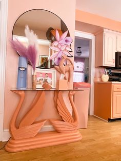 a mirror sitting on top of a table in a kitchen