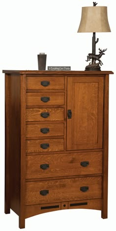 a wooden dresser sitting next to a lamp on top of a table