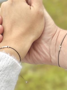 A perfect, personalized gift for partners or best friends. Celebrate love, connection, and remembrance with our Minimalist Morse Code Bracelet. Whether it's for your boyfriend, husband, brother, father, or godfather, this bracelet makes a thoughtful gift for birthdays, anniversaries, or any special occasion. It's not just a piece of jewelry, it's also a meaningful symbol that represents your unique bond. Ideal as a gift for couples, this timeless design also serves as a keepsake for sisters or a Minimalist Silver Friendship Jewelry, Minimalist Silver Jewelry For Friendship, Modern Sterling Silver Friendship Bracelets, White Gold Friendship Bracelets, Dainty Silver Promise Bracelets, Dainty Silver Bracelets For Promise, Minimalist Sterling Silver Jewelry For Friendship, Sterling Silver Friendship Bracelet With Sliding Knot, Silver Couples Jewelry For Friendship