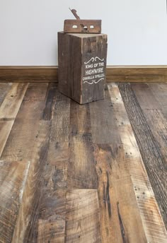 an old wooden box sitting on top of a hard wood floor next to a new one