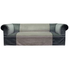 a gray and black couch sitting on top of a white floor