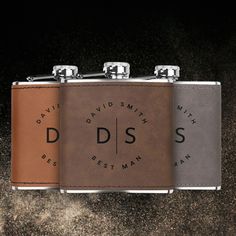 two leather flasks with the words david smith and best man printed on them