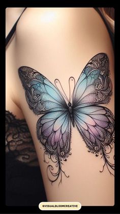 a woman's back with a butterfly tattoo on it