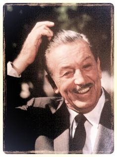 an old photo of a smiling man in a suit and tie with his hand on his head