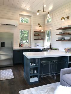 the kitchen is clean and ready to be used as a living room or dining area