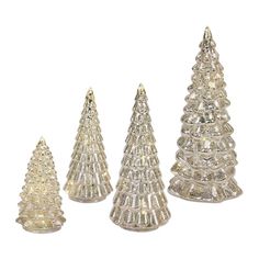 five small glass christmas trees on a white background