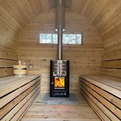 a wood burning stove in a wooden room