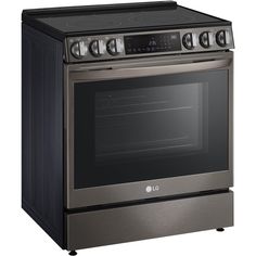 a black and stainless steel oven with four burners on the front, and one door open