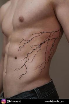 a man's stomach with a lightning tattoo on his chest and the upper part of his body