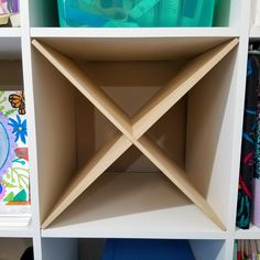 an open book shelf with several books on it