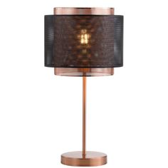 a table lamp with a black shade on it and a gold metal frame around the base