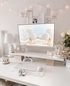 a computer monitor sitting on top of a white desk