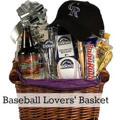 a baseball lover's basket with beer, snacks, and other items in it