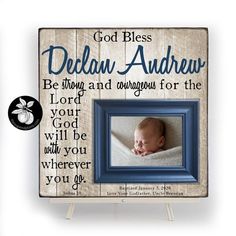 a wooden frame with a baby's photo and the words god bless, delhan andrews be strong and courageous for the lord