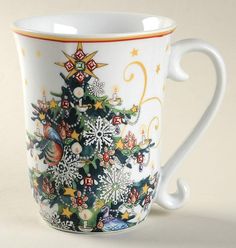 a white coffee cup with a christmas tree on it