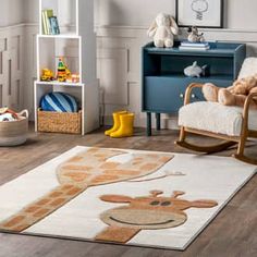 a child's room with a rocking chair and rug