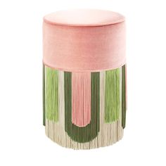 a pink and green stool with tassels on the bottom, in front of a white background