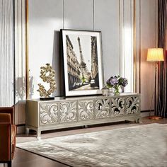 an ornately decorated living room with art on the wall