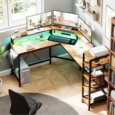 a computer desk with two monitors and a keyboard on it in front of a window