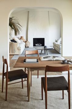 a living room filled with furniture and a fire place