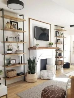 the living room is clean and ready for us to use it's fireplace as a focal point