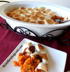 a plate with a piece of pie on it next to a bowl of desserts