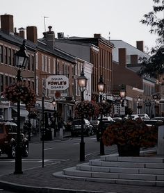 a city street with cars parked on both sides