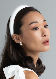 This is how Jennifer Behr does the classic padded headband, one of our best-selling silhouettes. This Tori Headband is crafted from silk, creating a rich luster. We take fit seriously, and our headbands are wear-tested to be comfortable all day. Dimensions: 1 inch width, 1 inch height. Overall 5.9 x 5.5 inches Thick Headbands, Luxury Hair Accessories, Wedding Hair Headband, Bride Headband, Jennifer Behr, Silk Headband, Padded Headband, White Headband, Glam Wedding